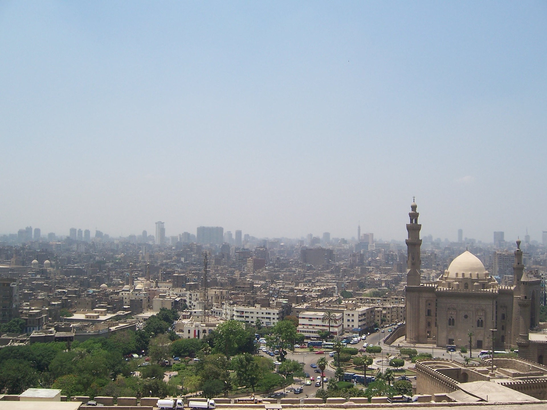 Dense Cairo panorama with a mosque in the foreground