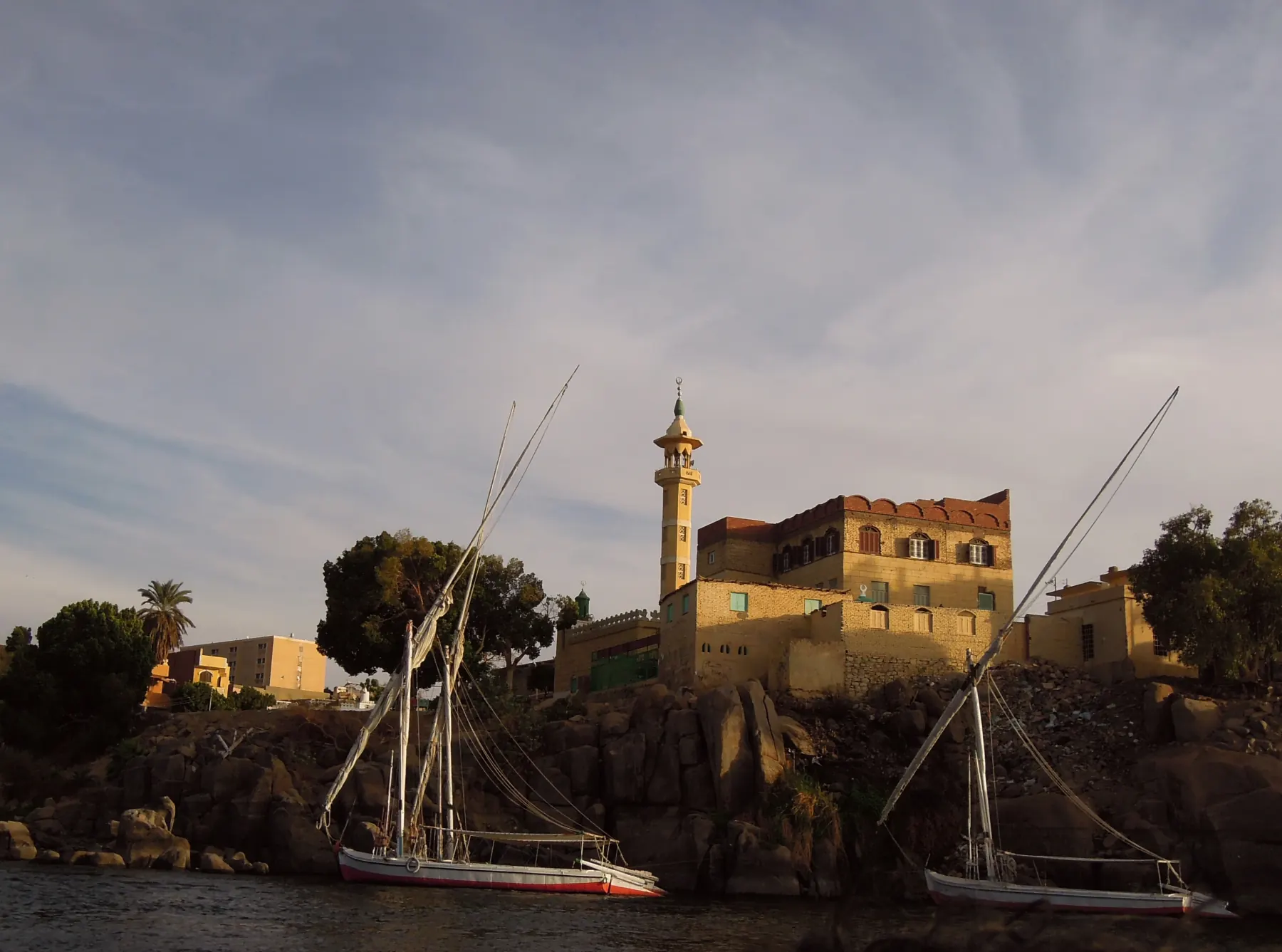 Feluccas on the Nile at sunset in Aswan